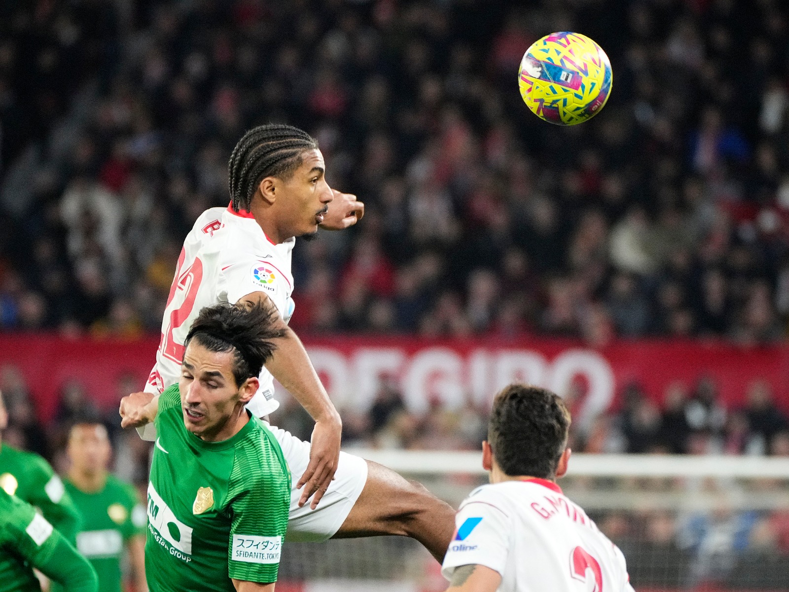 A defensive action shot during the game between Sevilla FC and Elche CF