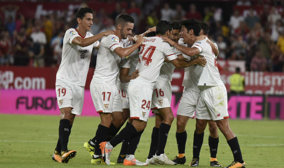 Sevilla players celebrate a goal