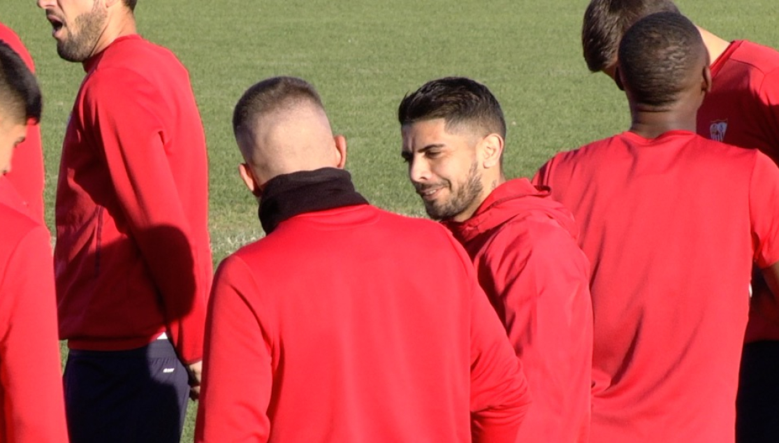 Banega y Carriço conversan en el entrenamiento