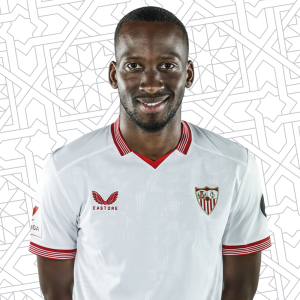 Dodi Lukébakio posando con la camiseta del Sevilla FC